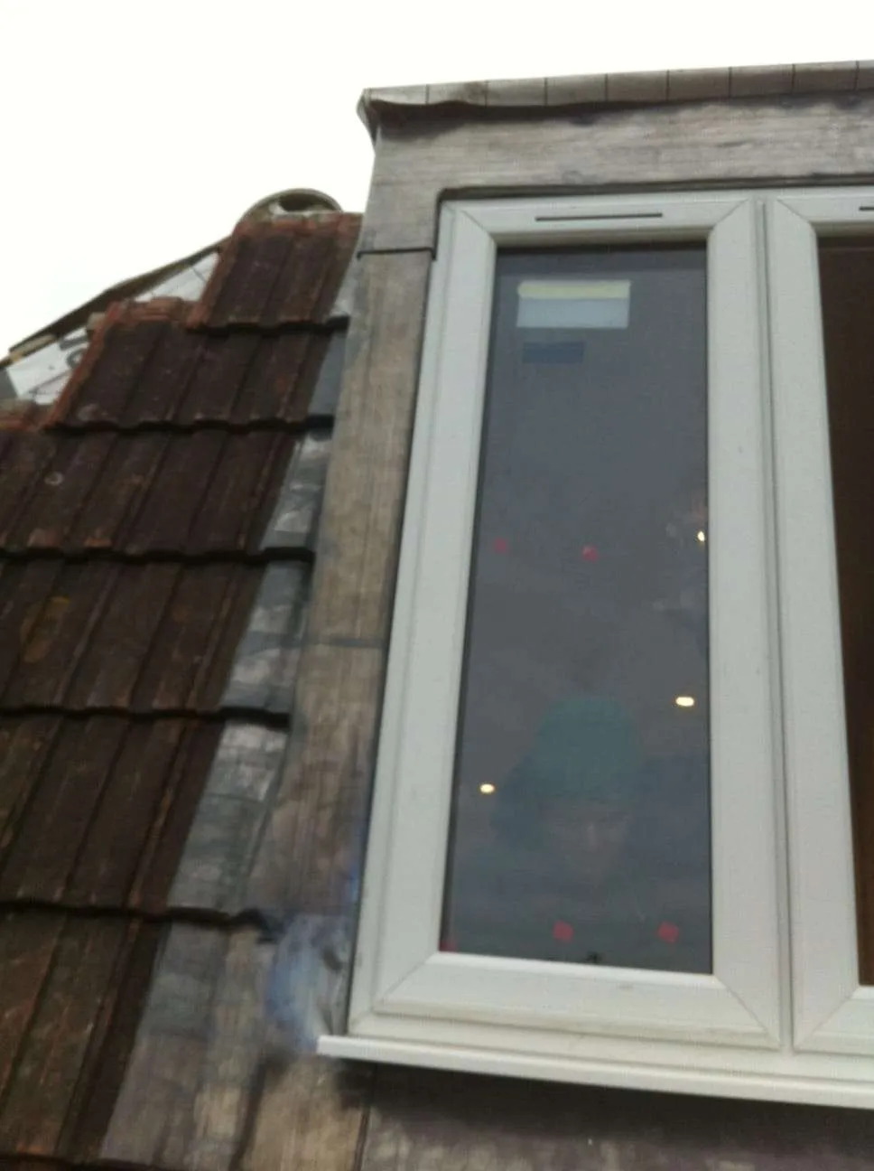 Dormer window exterior with tiled roof on completed loft conversion