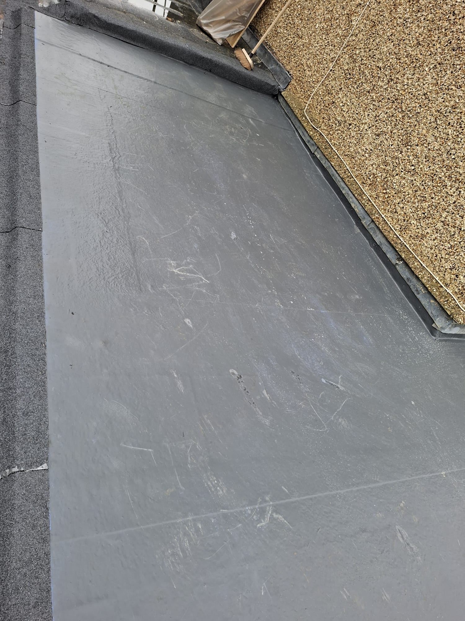 Close-up of EPDM rubber roof membrane showing clean seam detail