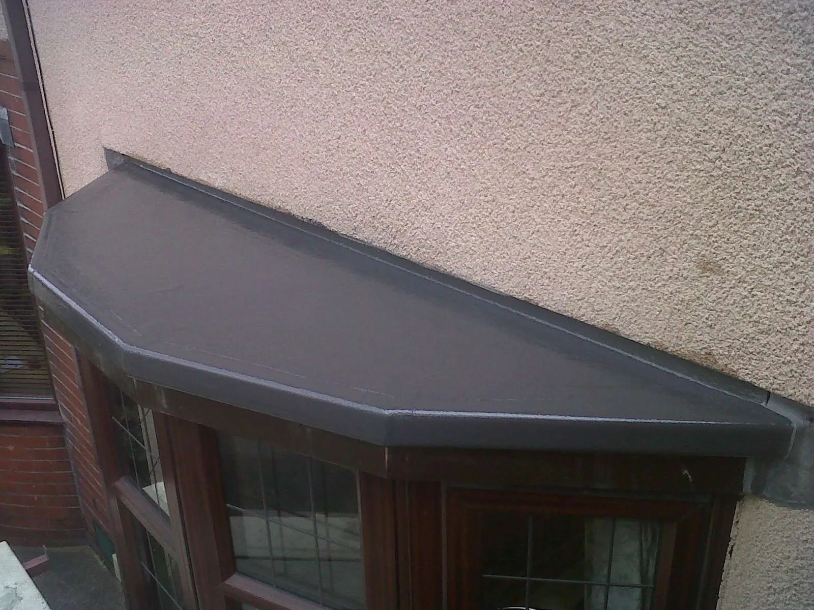 Completed flat roof installation on garage extension in North London