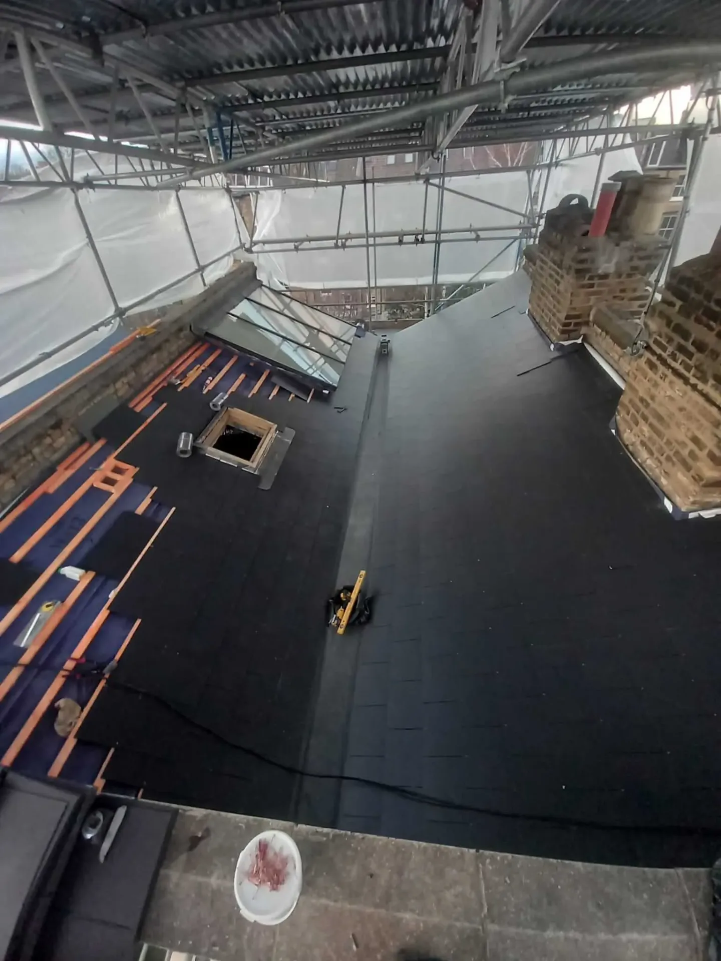 AC Roofing team completing flat roof installation on residential property in North London