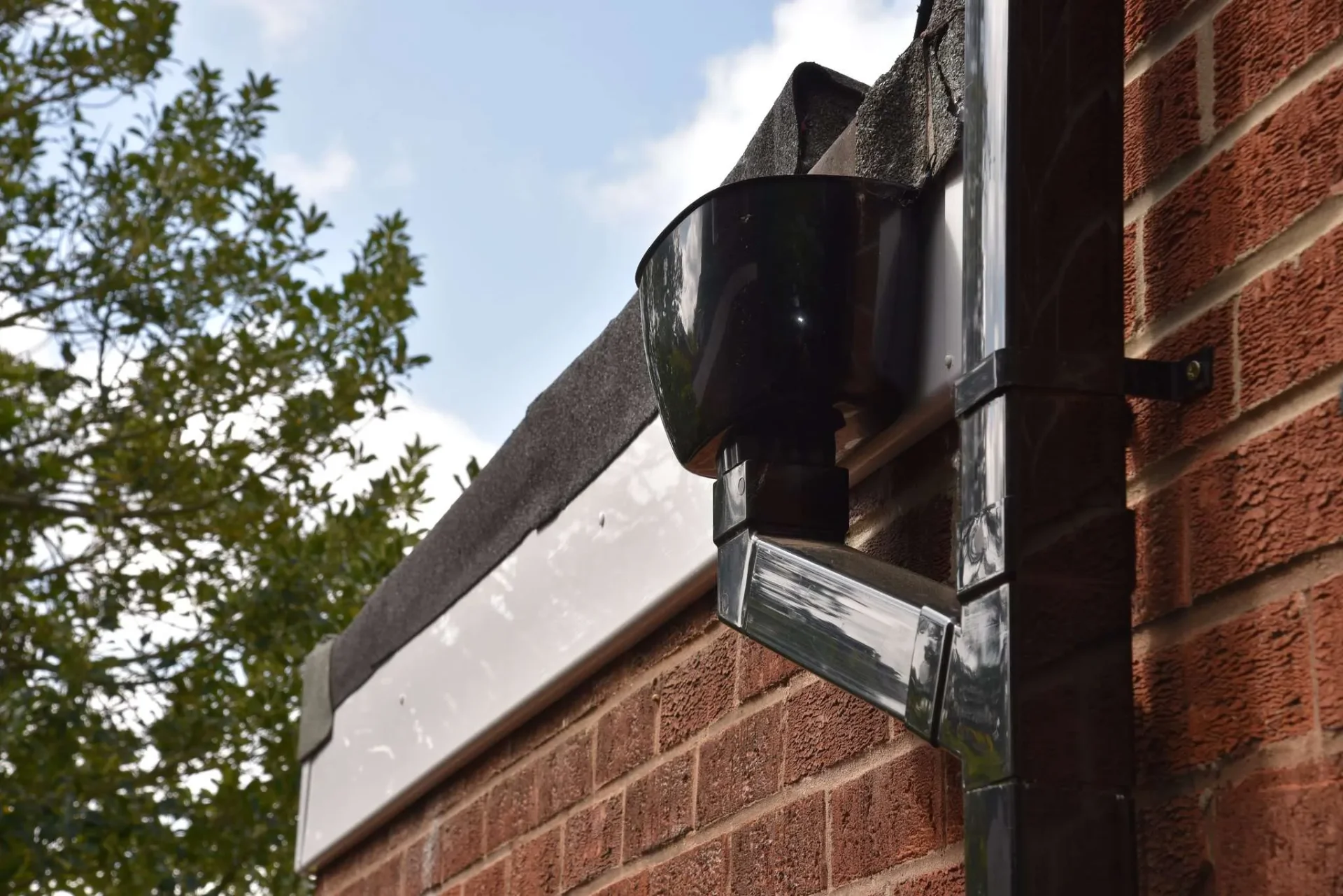 New gutter and downpipe system installed by AC Roofing