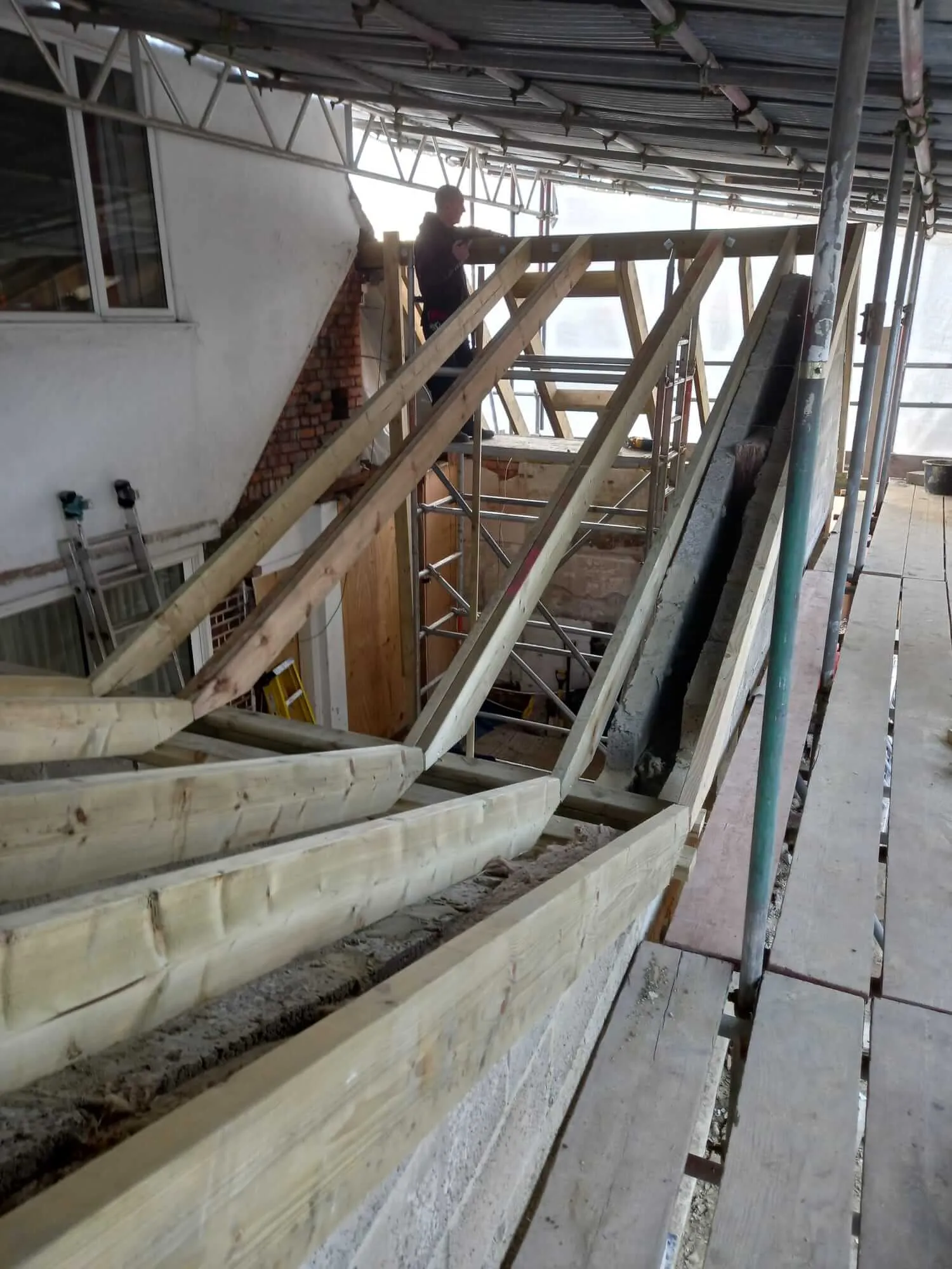 Loft conversion structural steelwork with new roof rafters and blockwork walls