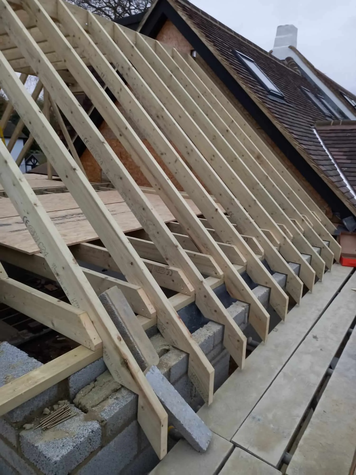 Timber roof structure for loft conversion with protective scaffolding