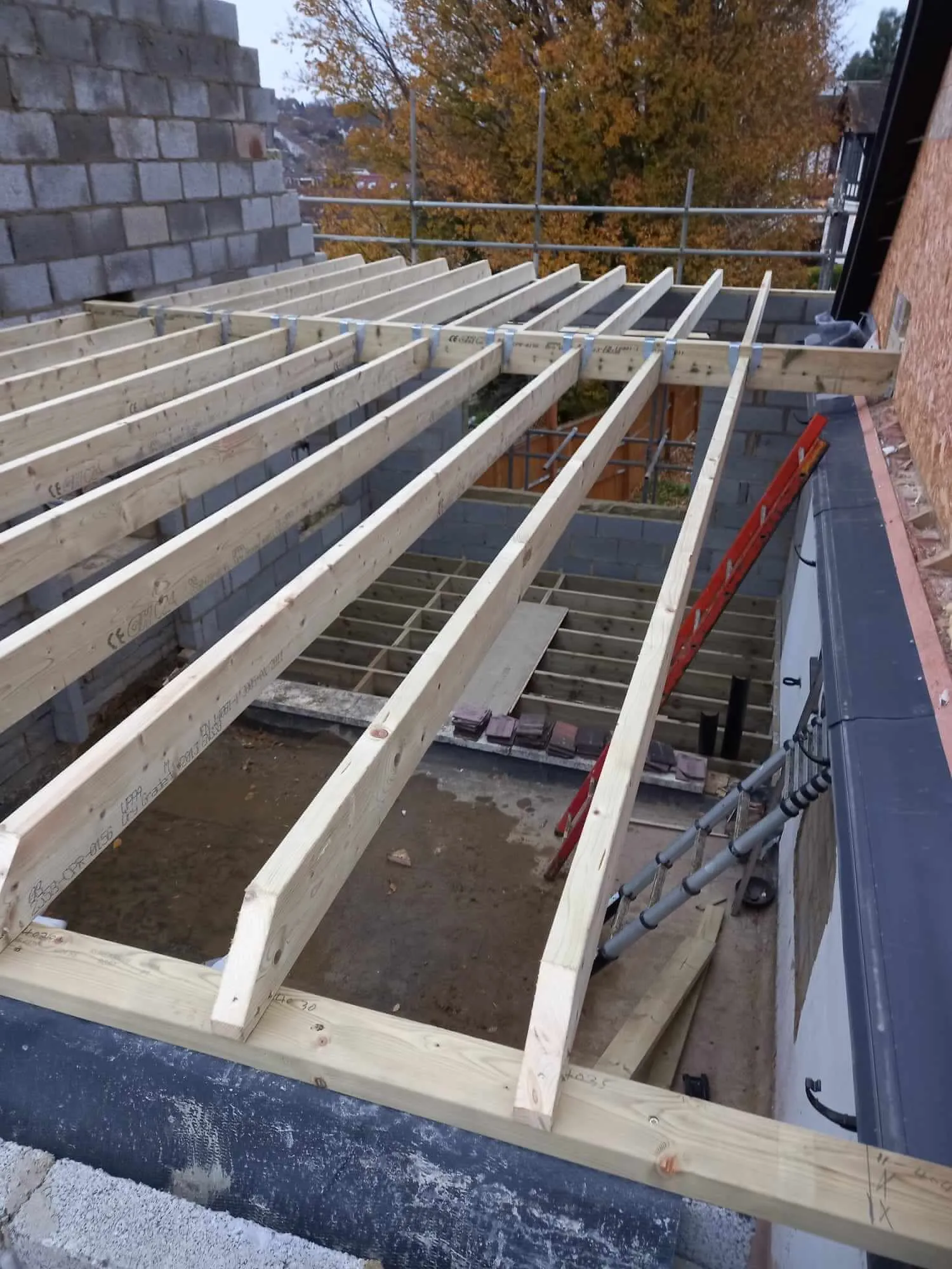 Loft conversion roof structure with scaffolding during construction phase