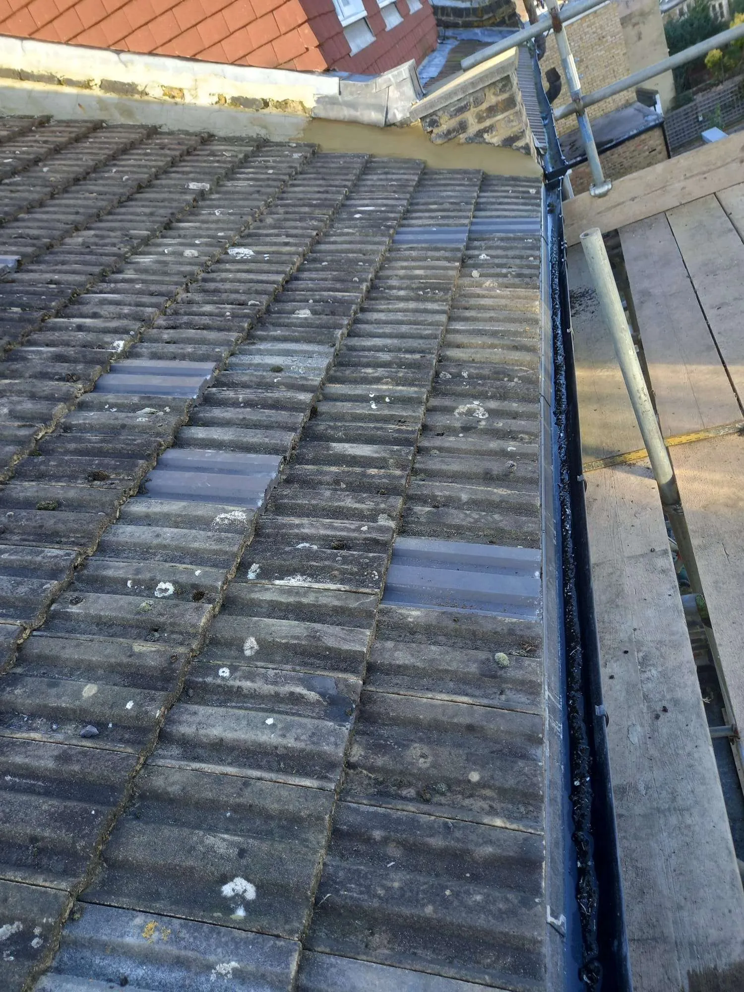 Breathable membrane detail at eave with new black guttering installed