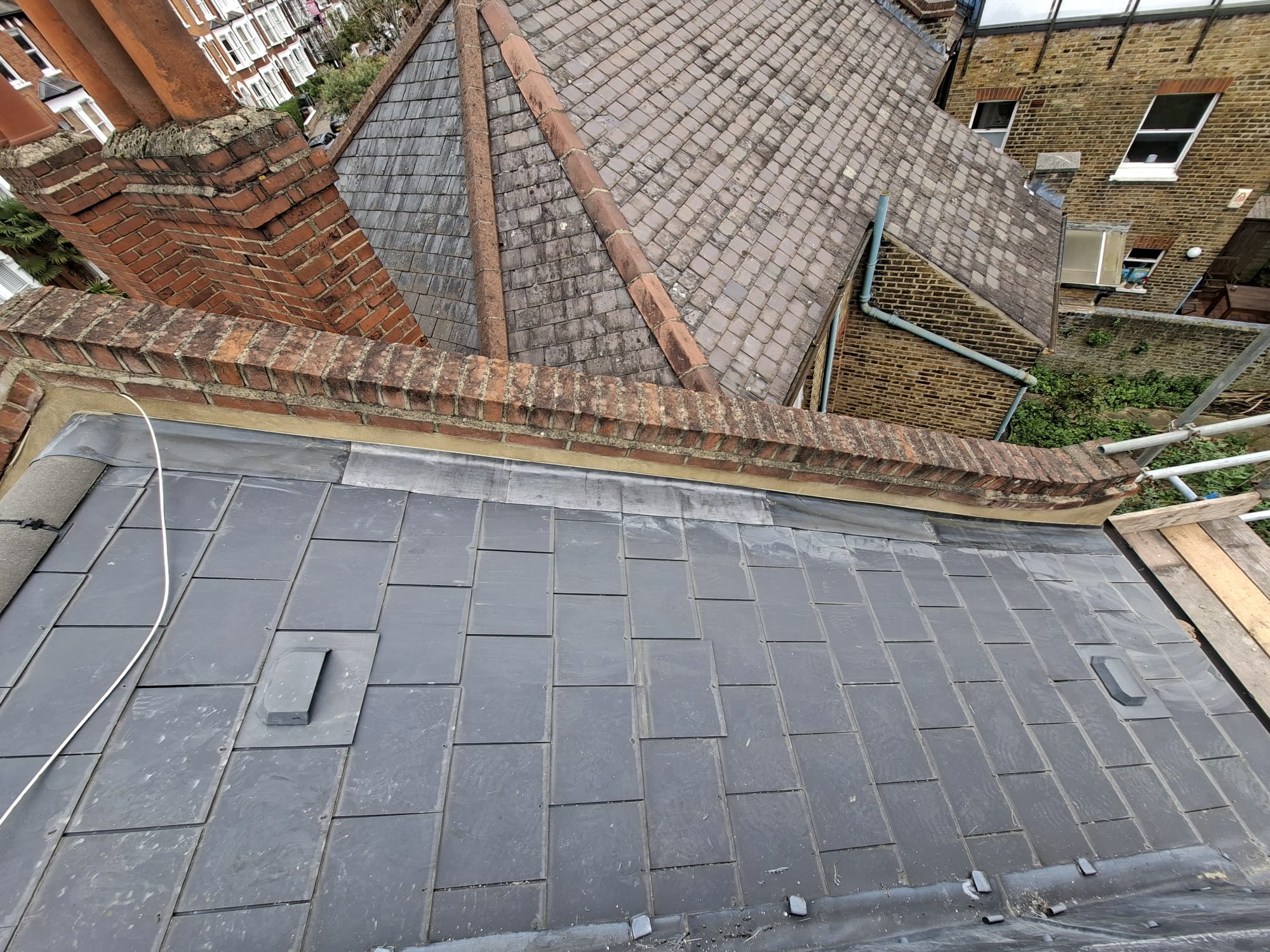 New slate roof installed on Victorian property with brick detailing