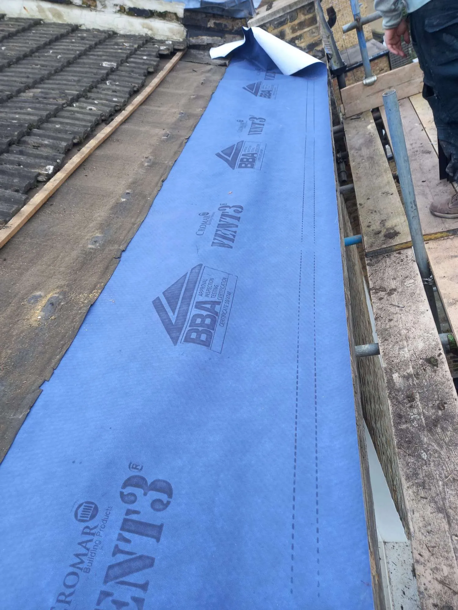 Damaged roof felt and mortar requiring urgent repair in North London