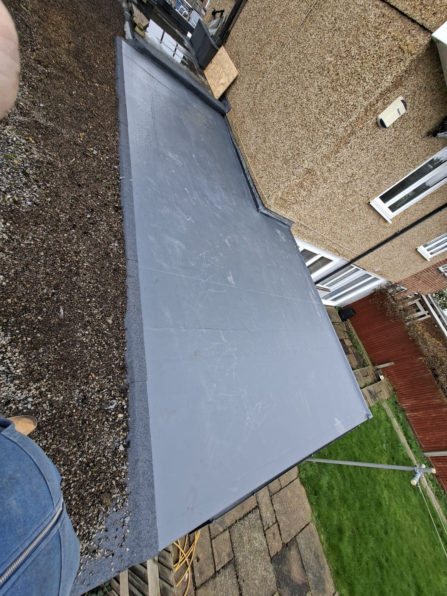 Aerial view of rubber flat roof with clean membrane finish