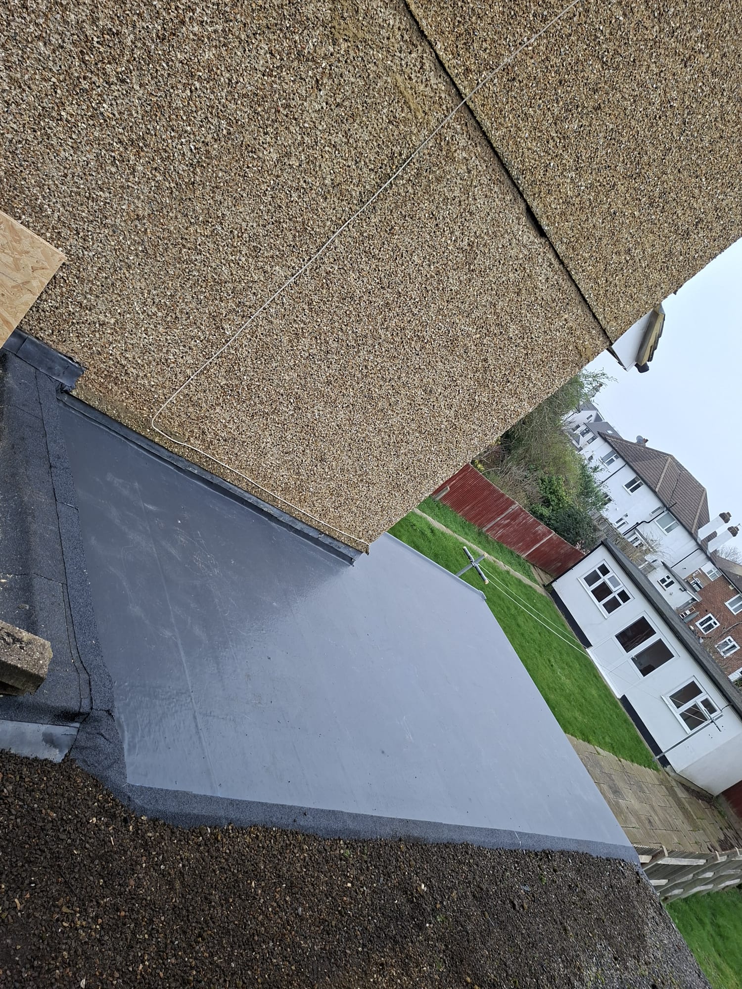 Completed rubber flat roof aerial view overlooking garden
